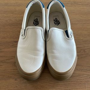 Van’s men’s white leather slip ons with blue suede accent